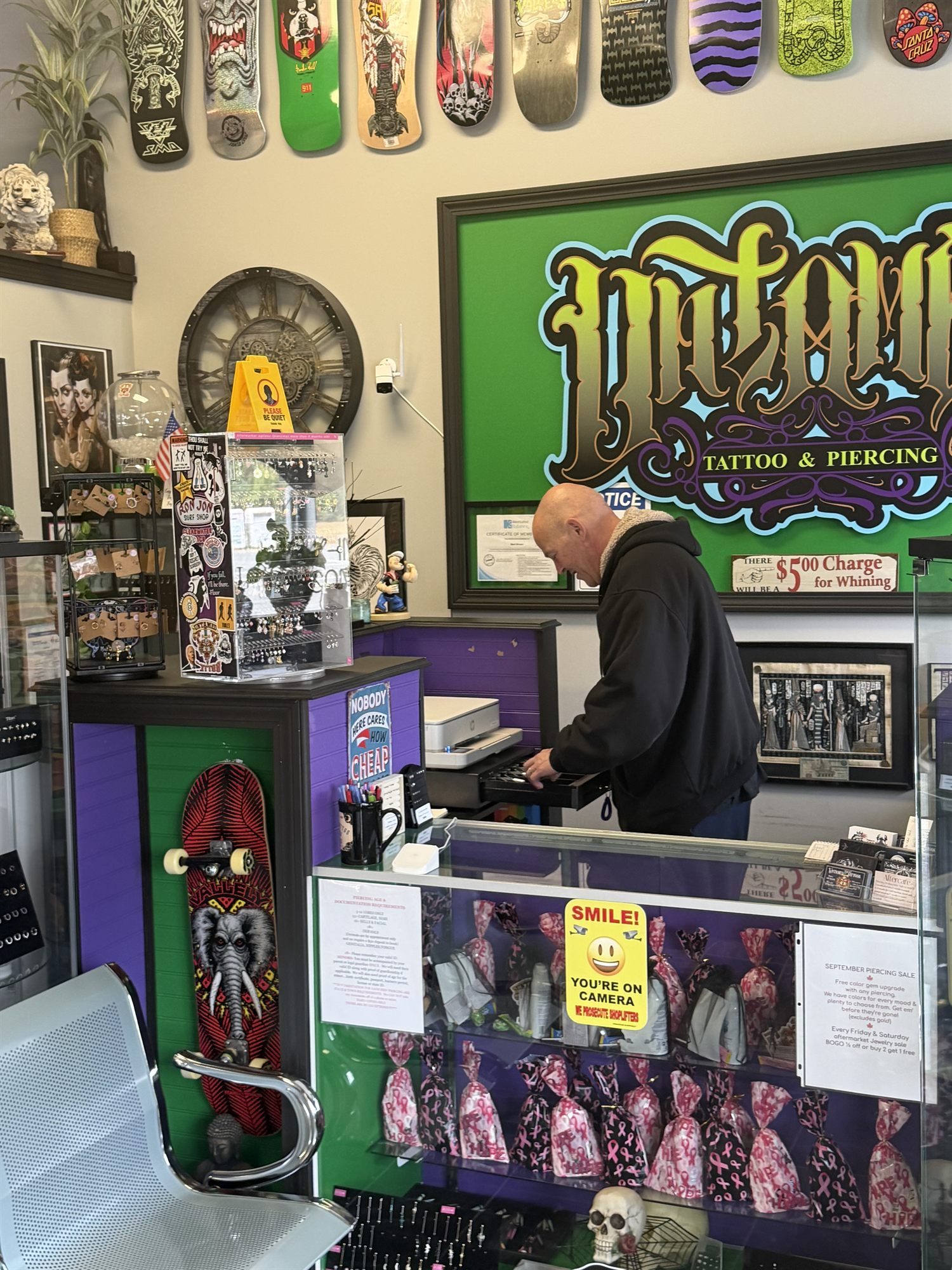 Front counter and jewelry displays at Untamed Tattoo & Piercing