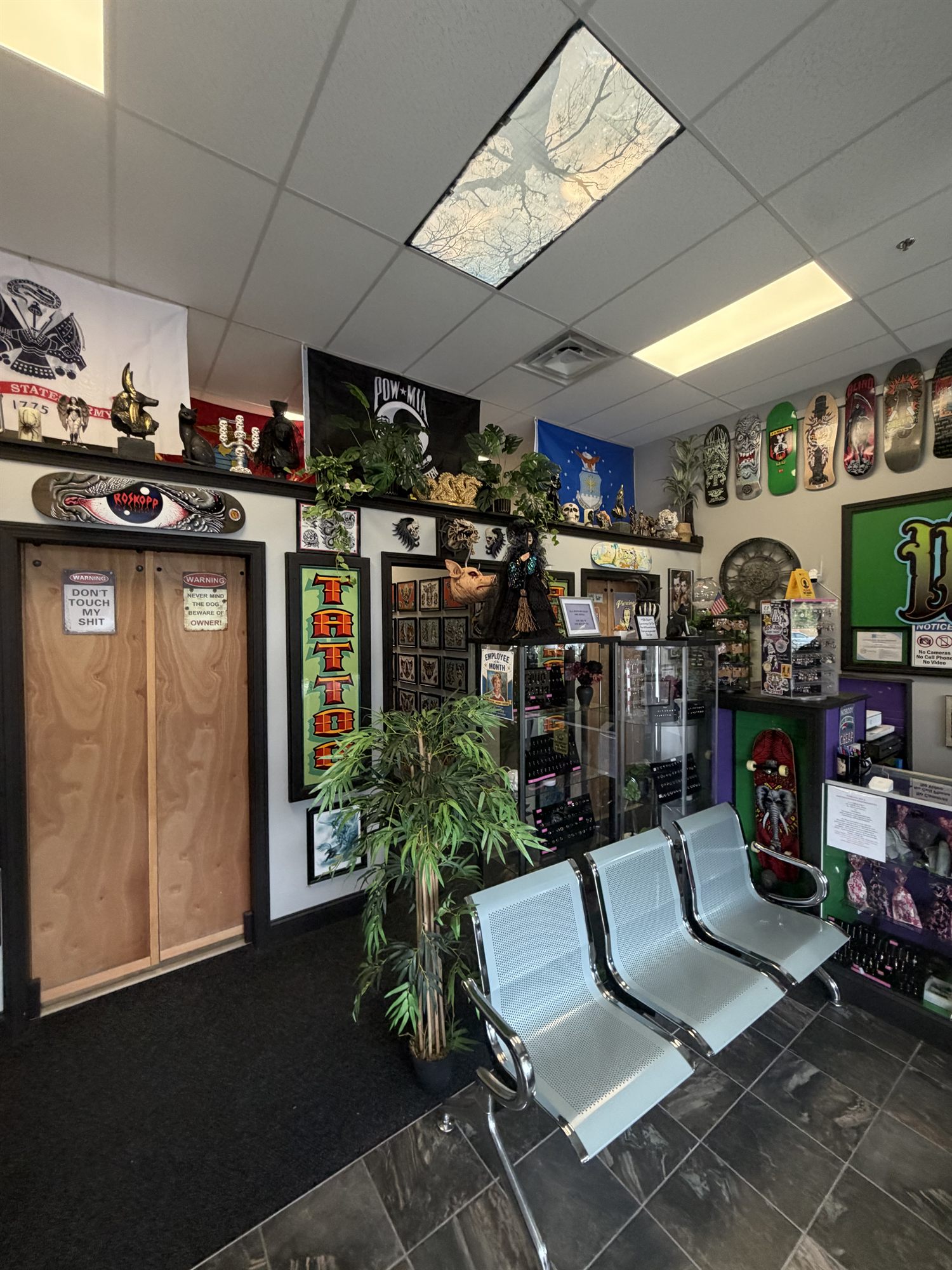 Waiting area and jewelry cases at Untamed Tattoo & Piercing